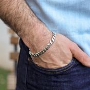 Men's curb bracelet is crafted from 925 sterling silver links and fastened with a convenient clasp.