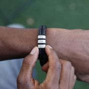 Cool leather bracelet with engraving. Made of black strong leather and silver charms