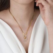 エマイニシャルクリスタル入れチャーム［ゴールドメッキ］