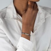 Tied together name bracelet with silver engraved charms and gray suede 